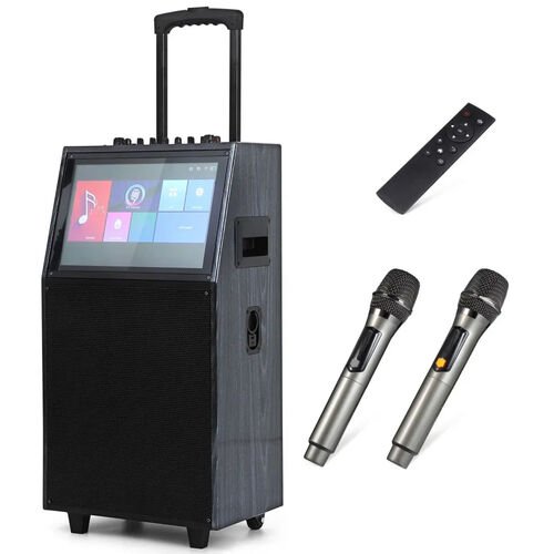 Enceinte de karaoke sur roulettes a poignee telescopique, ecran tactile encastre a l'avant, accompagnee de deux microphones sans fil et d'une telecommande