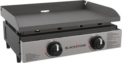 Plaque de cuisson Blackstone &agrave; gaz, surface plane en acier noir sur un b&acirc;ti inoxydable &agrave; deux boutons de r&eacute;glage